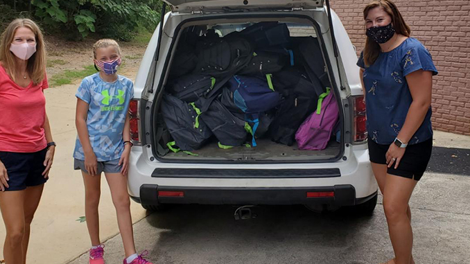 A trunkful of backpacks A trunkful of backpacks