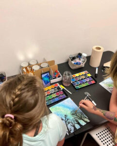 Girls painting at Art Camp
