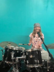 girl playing drums