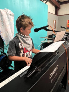 boy playing piano