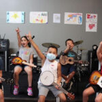 Kids rocking out at Stickandstrum Academy's Rockband Camp